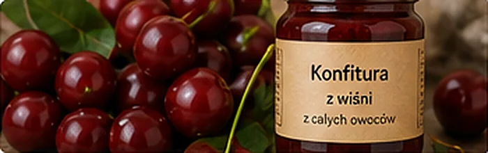 Świeże wiśnie obok słoika konfitury wiśniowej